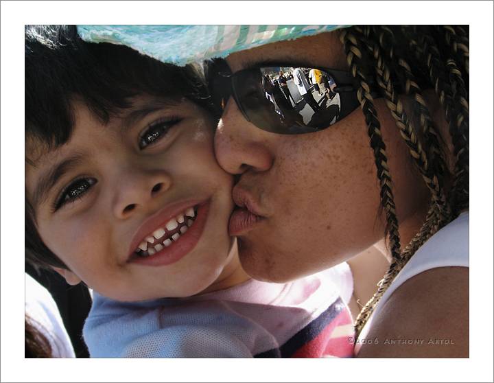 mother kissing son