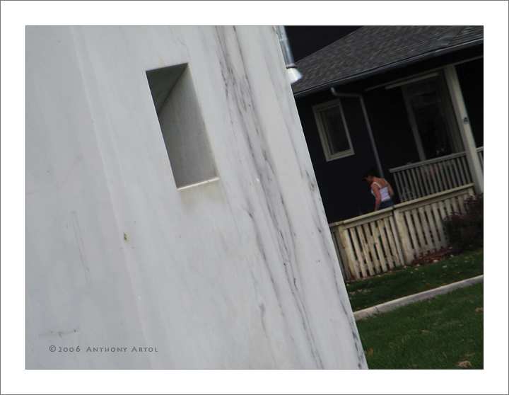 woman in white top on porch